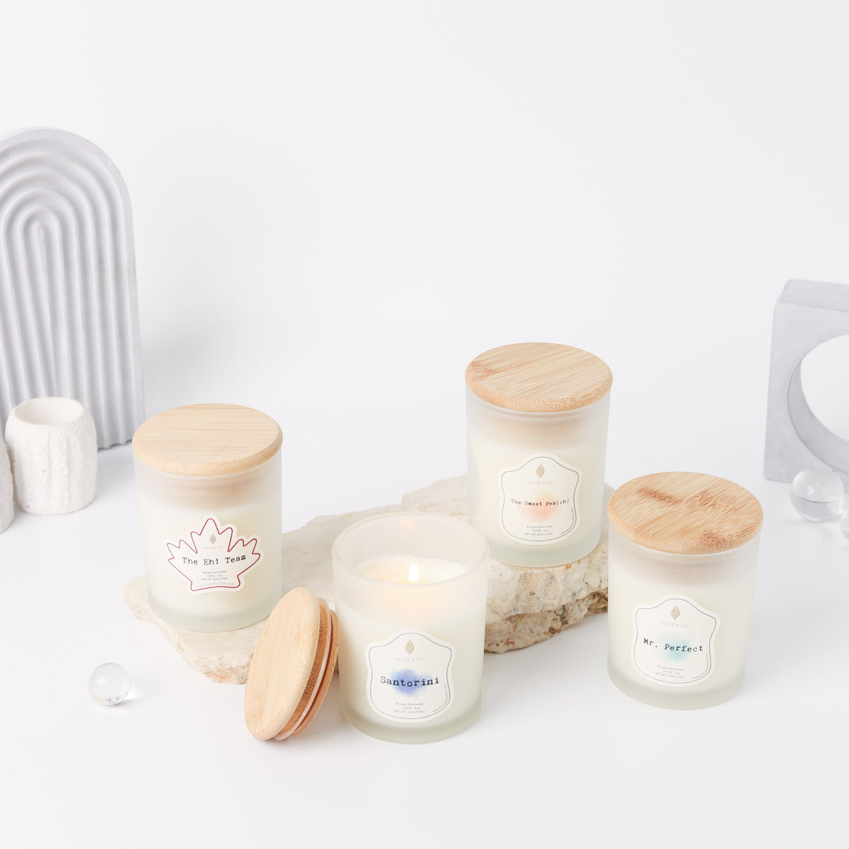 Santorini by Ollie & Co. with waterfall, sea.