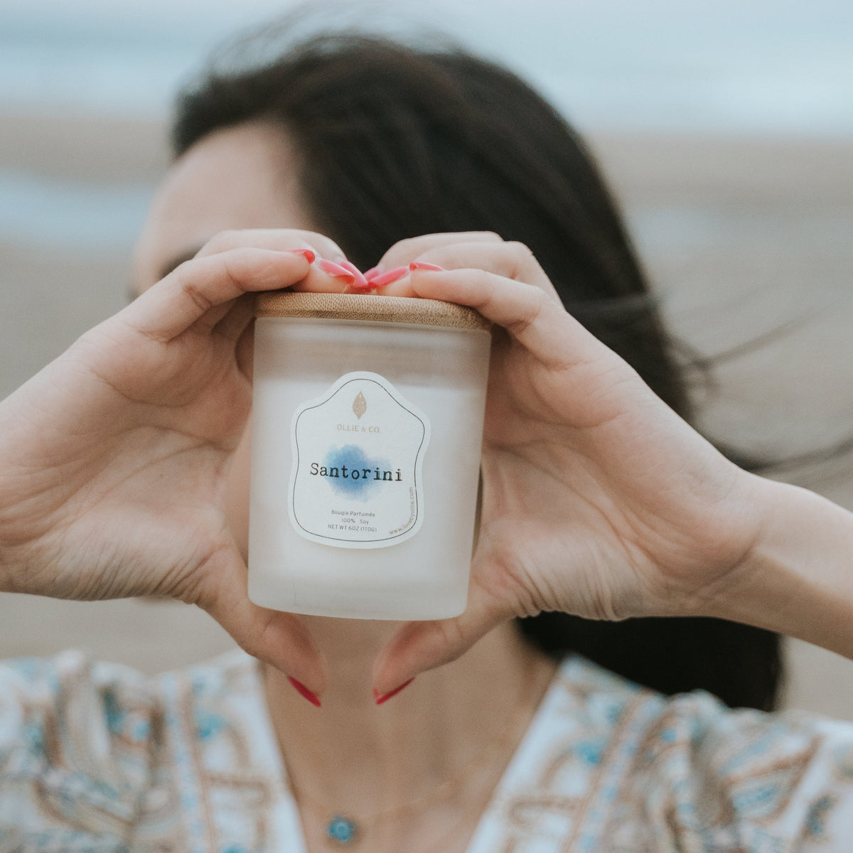 Santorini by Ollie & Co. with waterfall, sea.